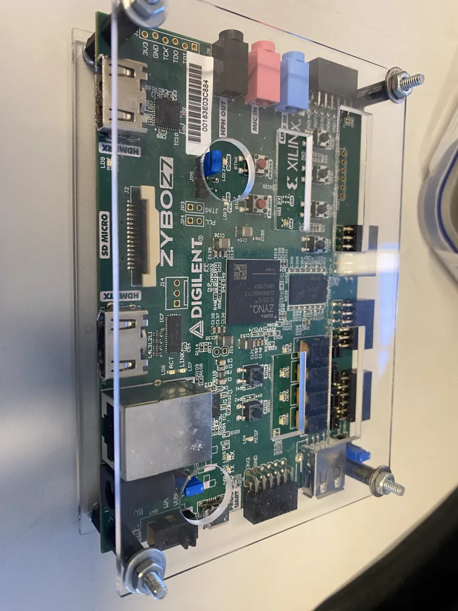 Digilent Zybo Z7 board with a Xilinx Zynq SoC, mounted between acrylic plates on standoffs